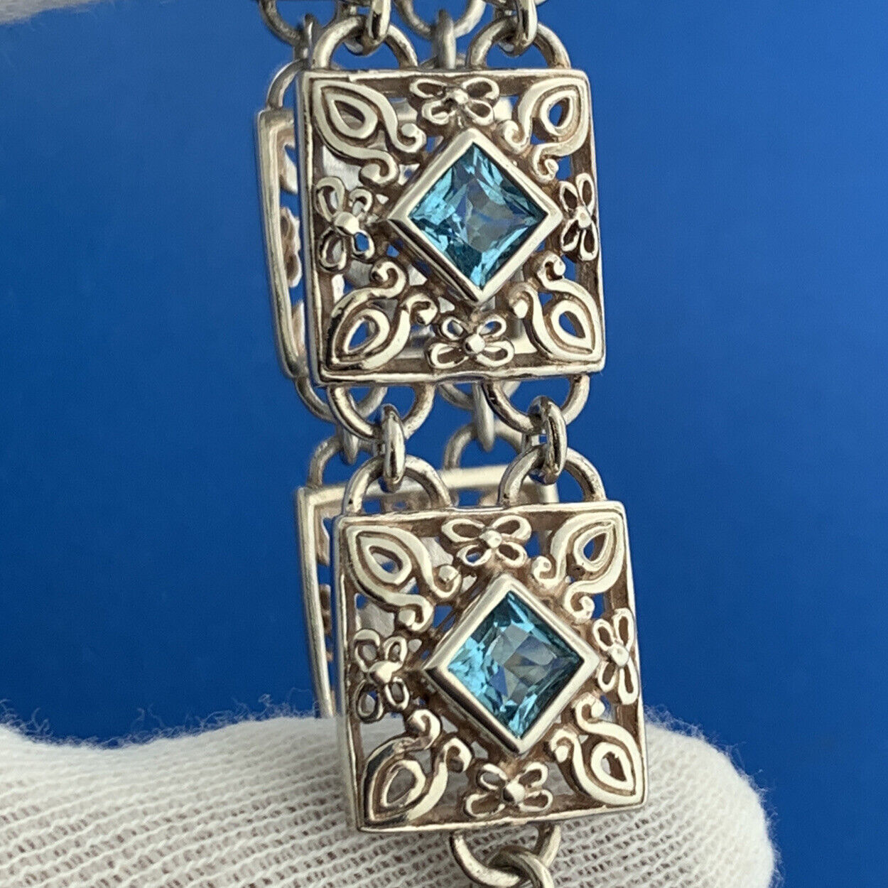 Designer NF Sterling Silver Square Blue Topaz Open Scroll Toggle Tennis Bracelet