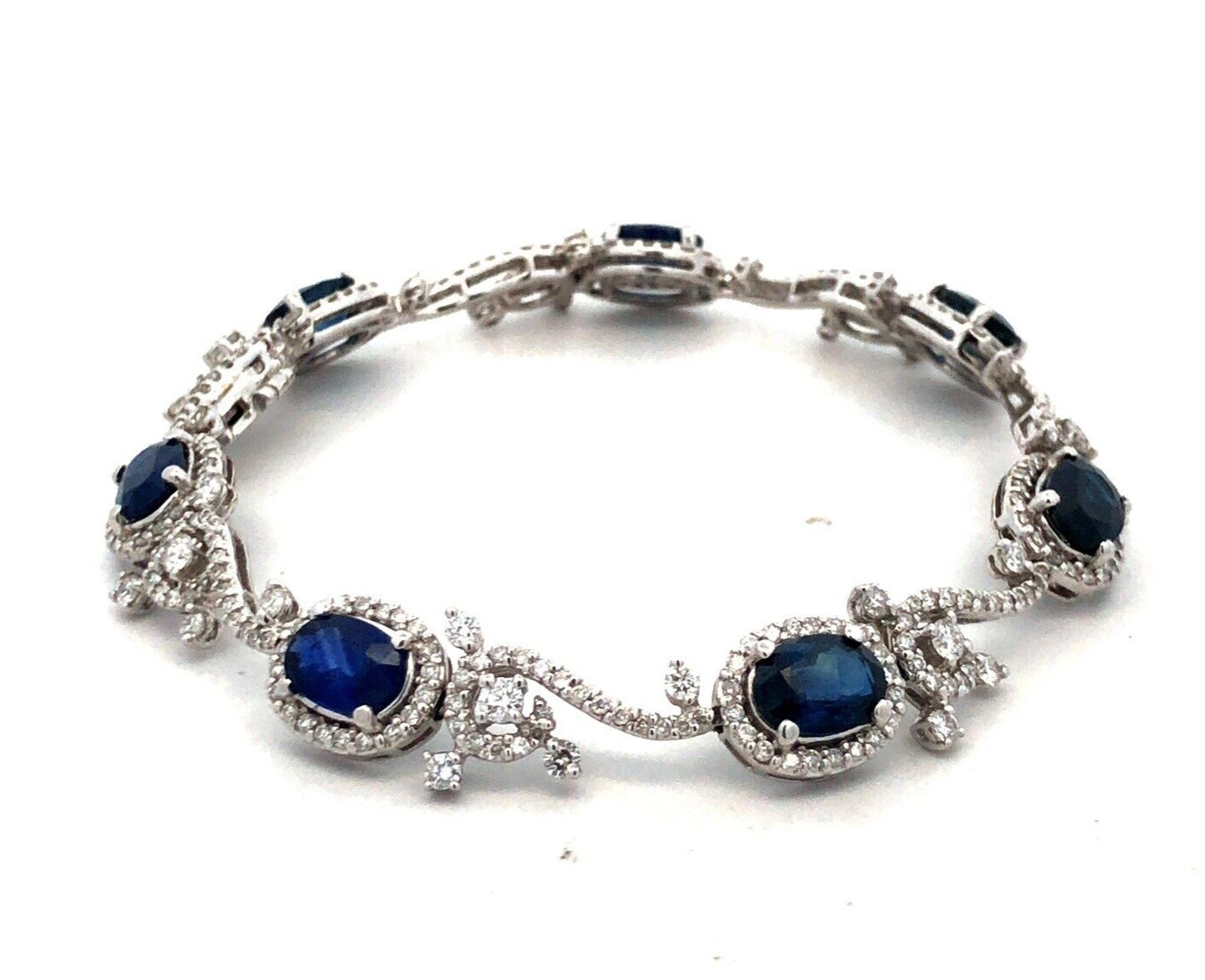 Designer K 18K White Gold Oval Blue Sapphire Diamond Swirl Tennis Bracelet