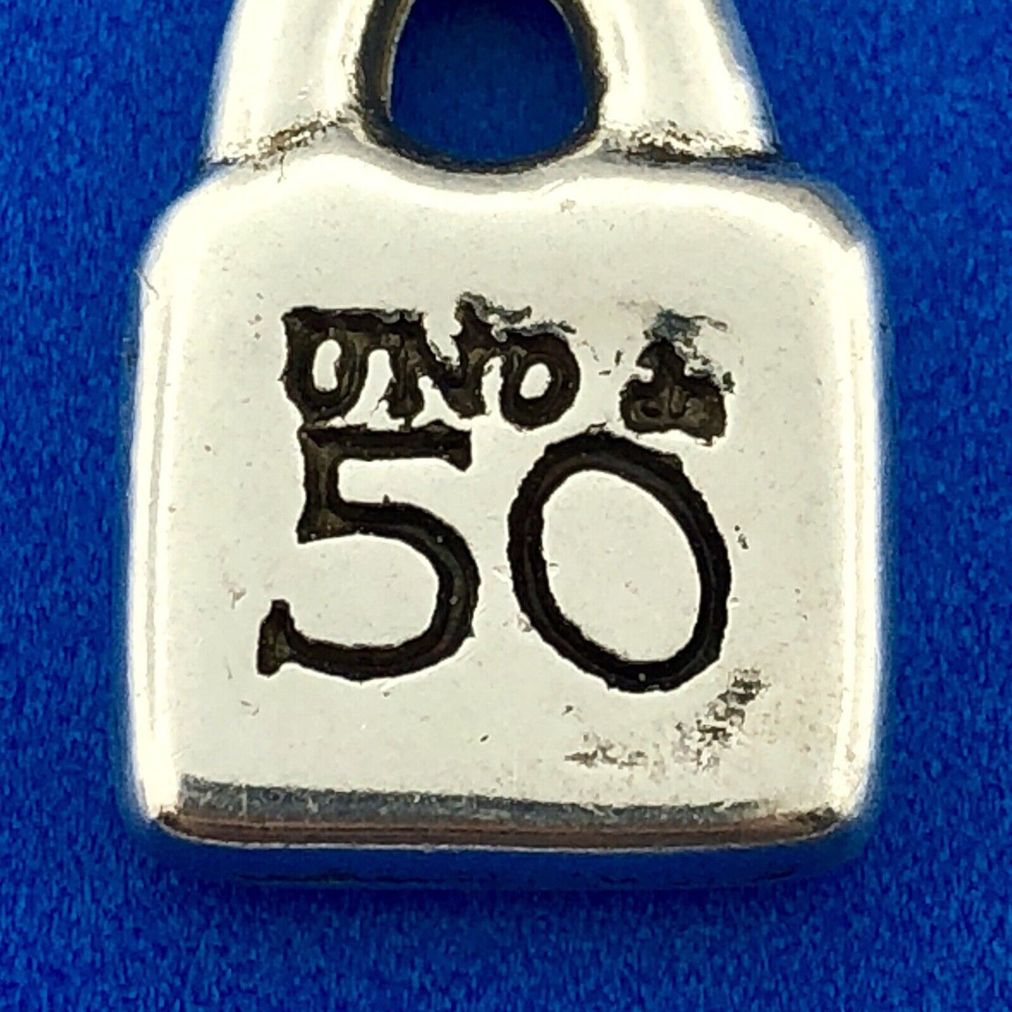 Designer Uno De 50 Silver Tone Sun Burst Purse Lock Charm Pendant