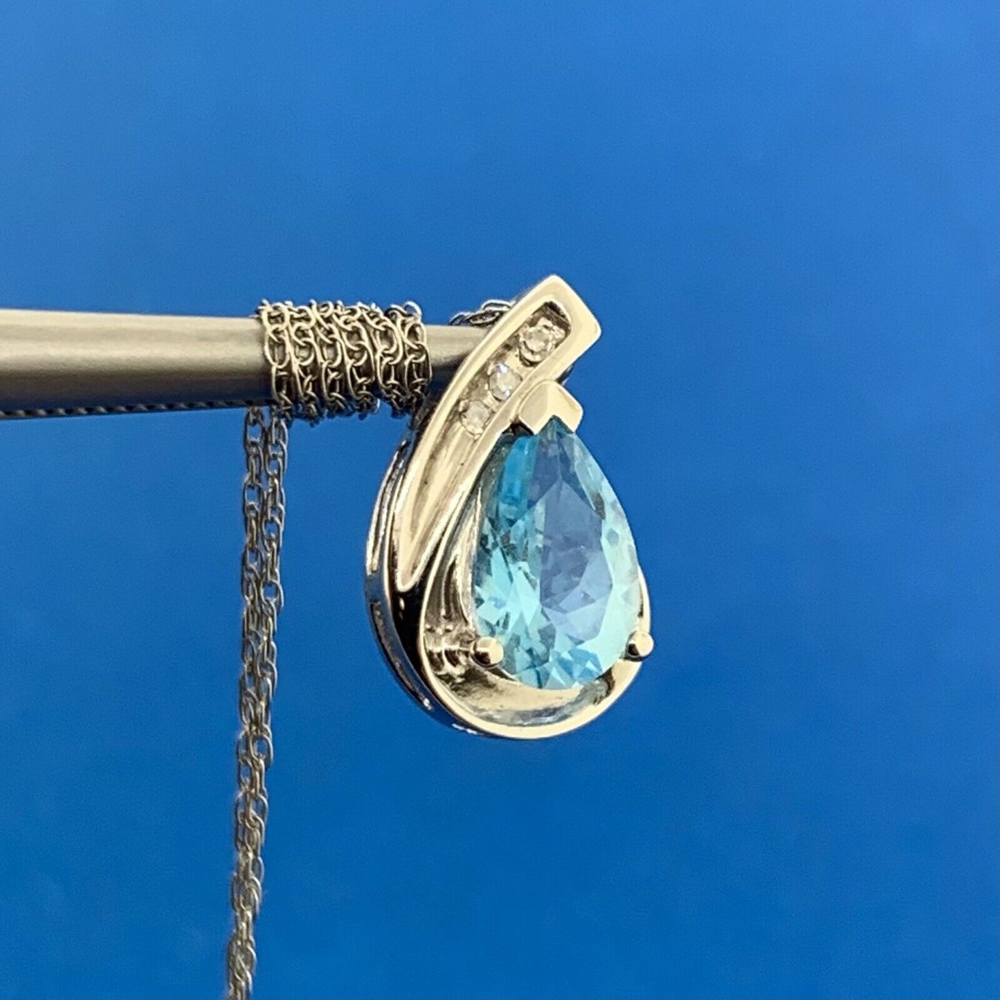 10K White Gold Pear Shaped Blue Topaz Diamond Accented Pendant Necklace