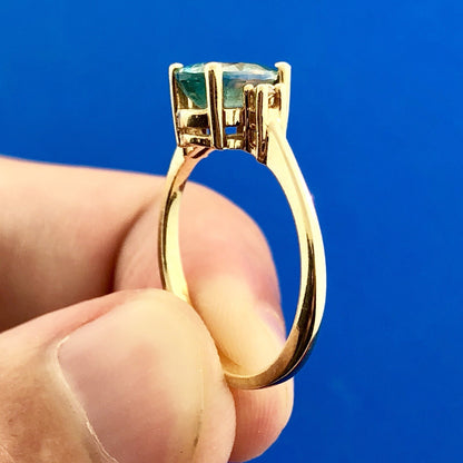 14k Yellow Gold Oval Blue Topaz Ring with Diamond Accents