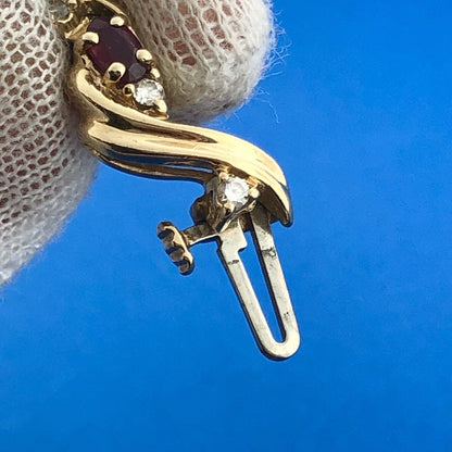 Gorgeous 14k Yellow Gold Oval Cut Ruby Diamond Accent Swirling Tennis Bracelet