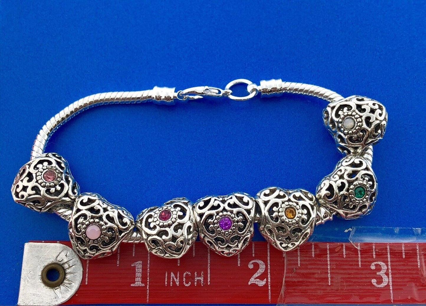 Silver Tone Slide Bracelet W/Seven 7 Heart Scroll CZ Interchangeable Charms