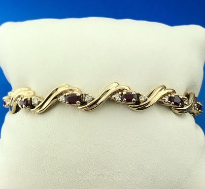 Gorgeous 14k Yellow Gold Oval Cut Ruby Diamond Accent Swirling Tennis Bracelet