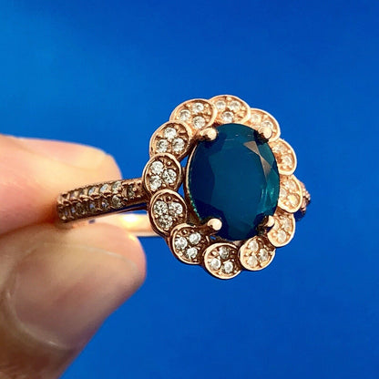 Strawberry Toned 925 Sterling Silver Oval Blue Cubic Zirconia White CZ Halo Ring