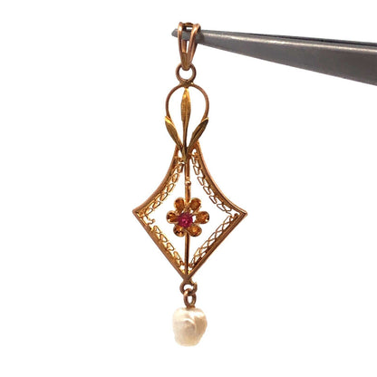 Lovely 10k Yellow Gold Round Cut Ruby and Pearl Cutout Floral Pendant