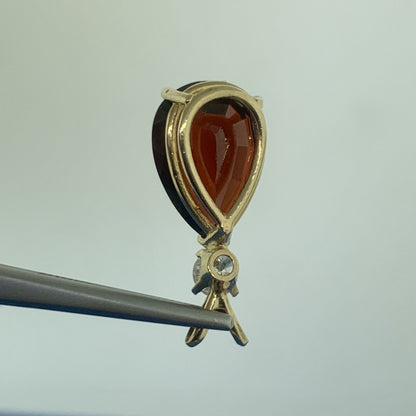 14K Yellow Gold Pear Shaped Garnet Round Diamond Accented Teardrop Pendant
