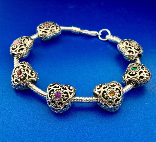 Silver Tone Slide Bracelet W/Seven 7 Heart Scroll CZ Interchangeable Charms