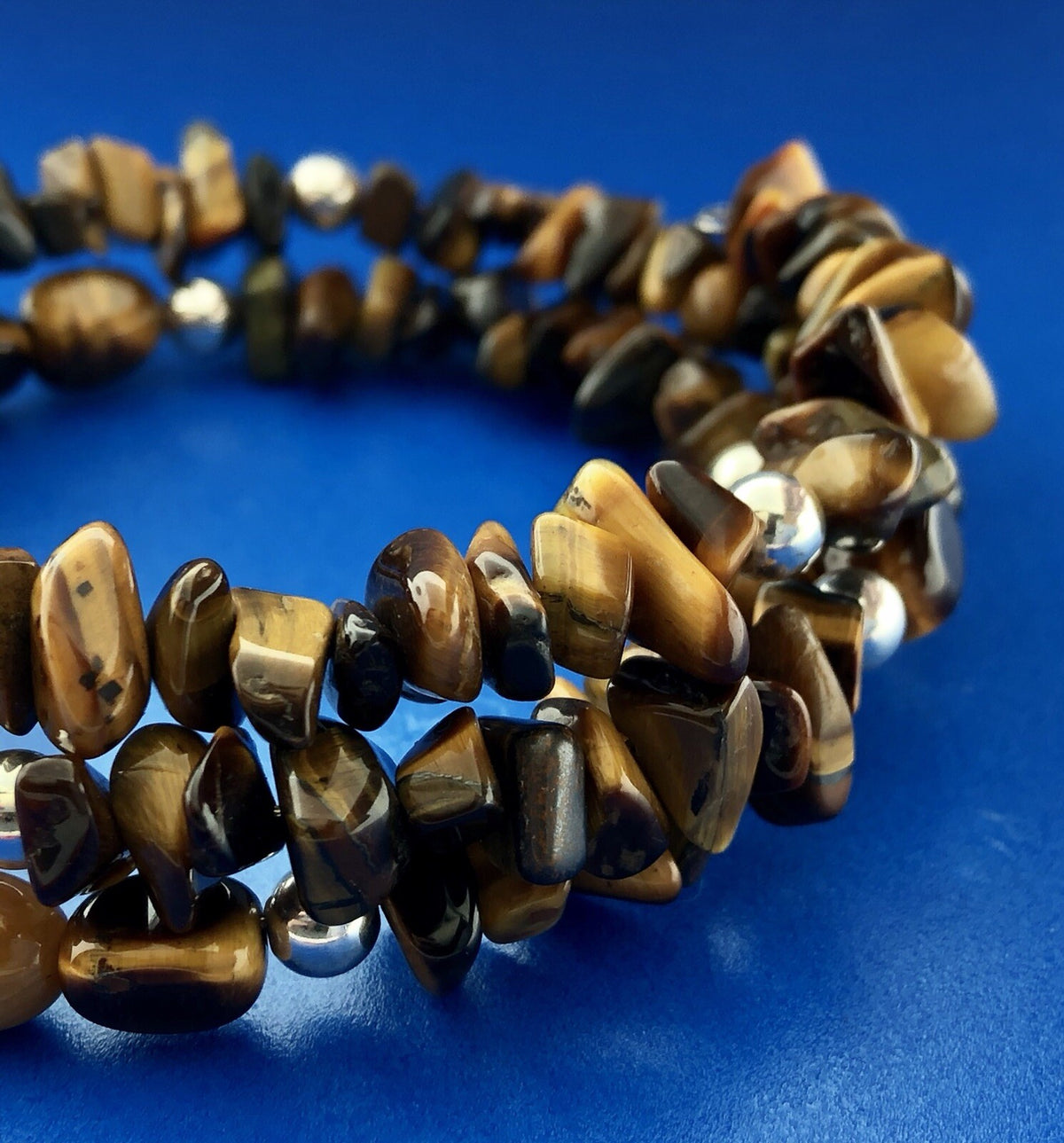 Sterling Silver Tigers Eye Bead Protection Three Wrap Flex Bracelet