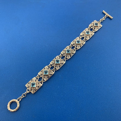 Designer NF Sterling Silver Square Blue Topaz Open Scroll Toggle Tennis Bracelet