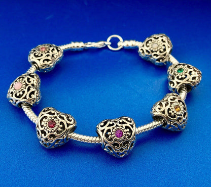 Silver Tone Slide Bracelet W/Seven 7 Heart Scroll CZ Interchangeable Charms