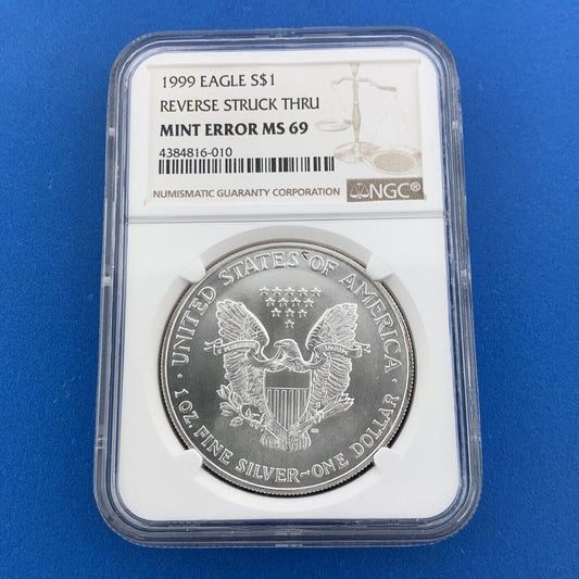 1999 $1 American .999 Silver Eagle Reverse Struck Thru Mint Error NGC MS69 Coin