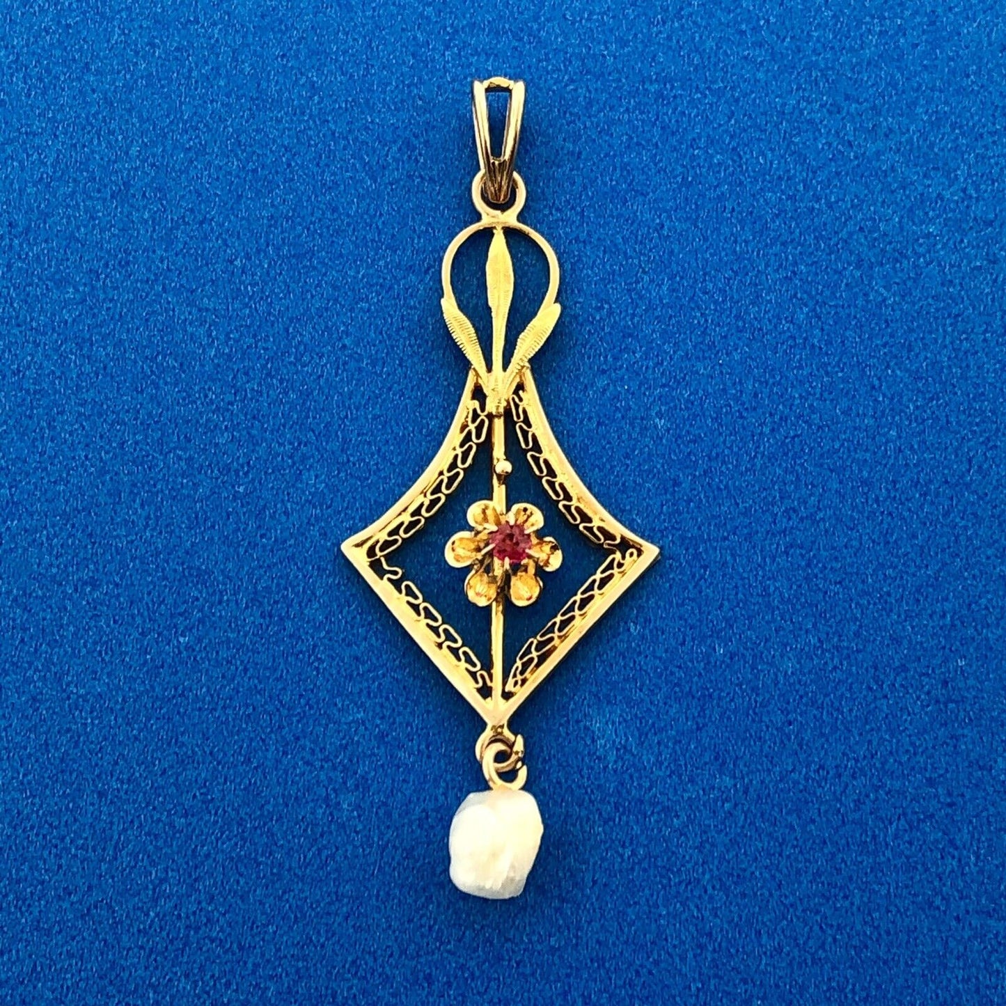 Lovely 10k Yellow Gold Round Cut Ruby and Pearl Cutout Floral Pendant