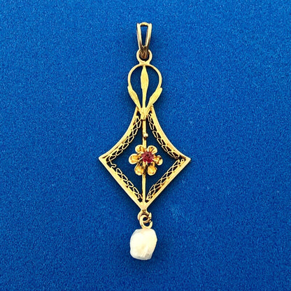 Lovely 10k Yellow Gold Round Cut Ruby and Pearl Cutout Floral Pendant