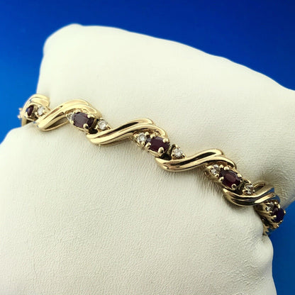 Gorgeous 14k Yellow Gold Oval Cut Ruby Diamond Accent Swirling Tennis Bracelet