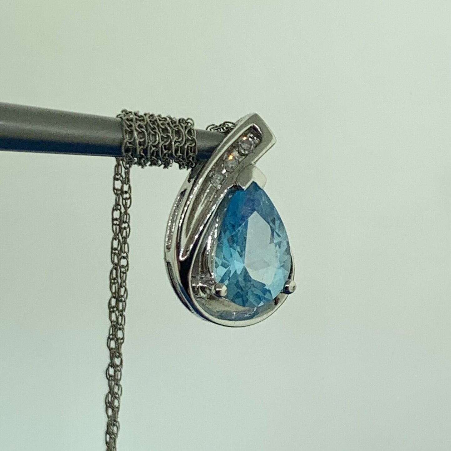 10K White Gold Pear Shaped Blue Topaz Diamond Accented Pendant Necklace