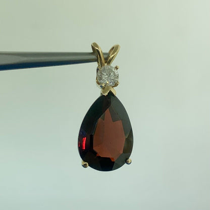 14K Yellow Gold Pear Shaped Garnet Round Diamond Accented Teardrop Pendant