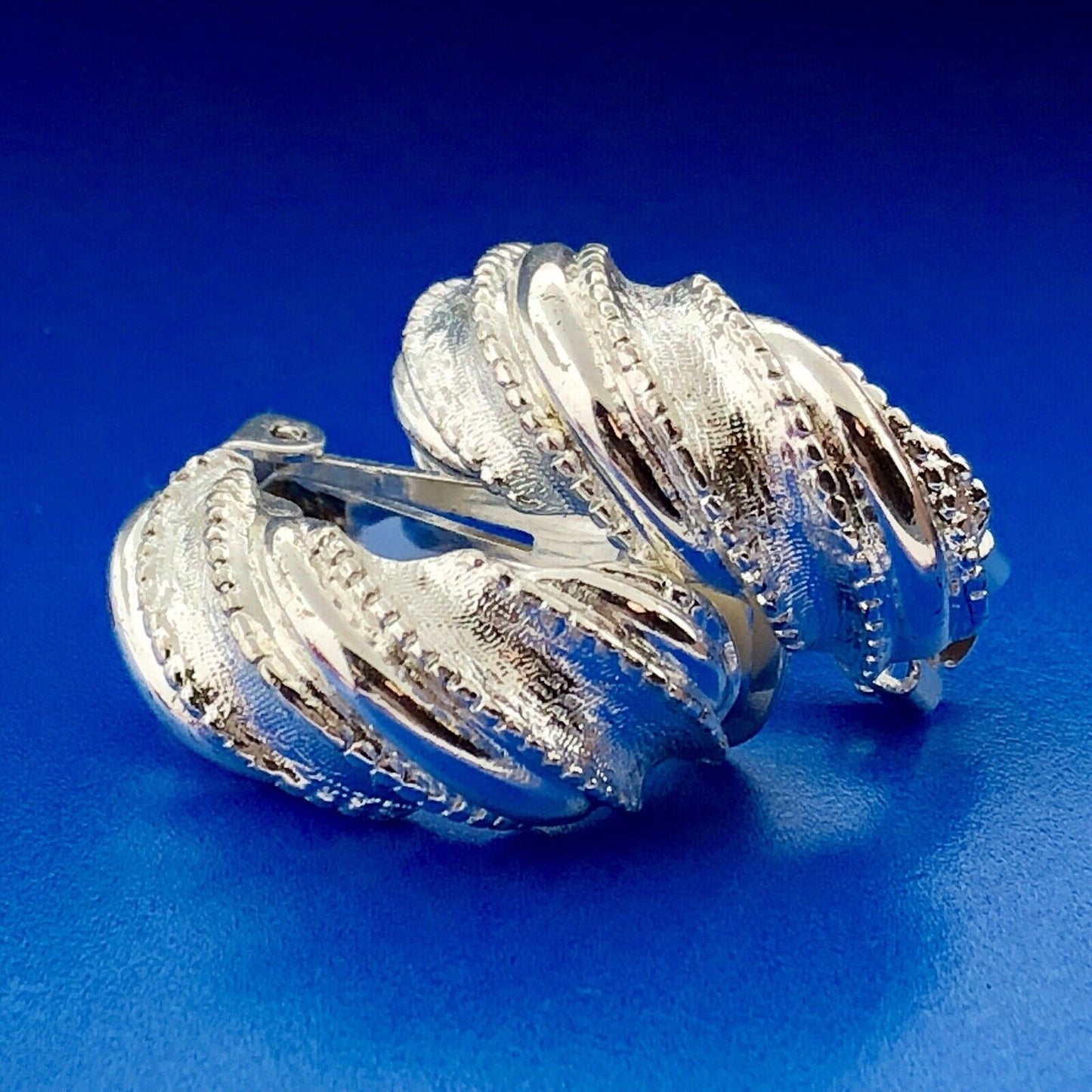 Classic Silver Tone Polished Textured Beaded Twist Half Hoop Clip Earrings