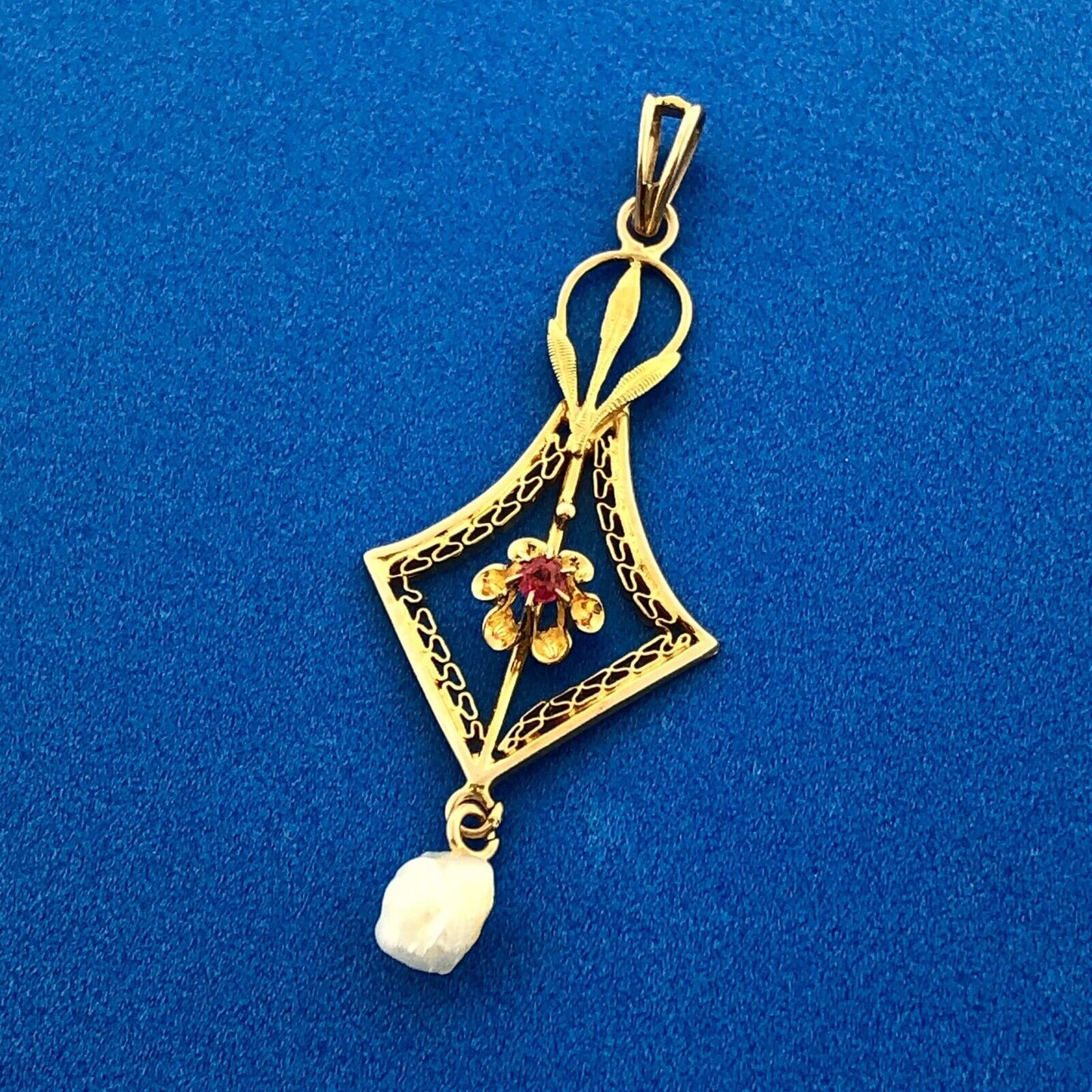 Lovely 10k Yellow Gold Round Cut Ruby and Pearl Cutout Floral Pendant