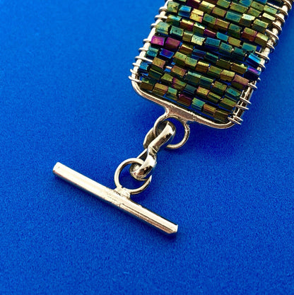 Artisan Silver Tone Iridescent Cylinder Bead Wire Wrapped Cross Toggle Bracelet