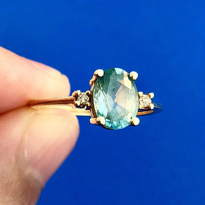 14k Yellow Gold Oval Blue Topaz Ring with Diamond Accents