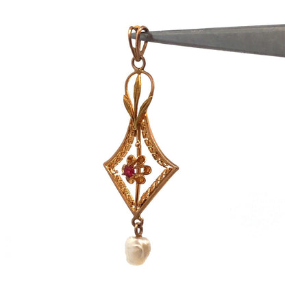 Lovely 10k Yellow Gold Round Cut Ruby and Pearl Cutout Floral Pendant
