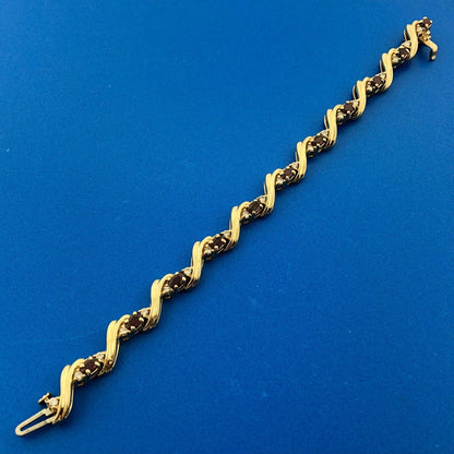 Gorgeous 14k Yellow Gold Oval Cut Ruby Diamond Accent Swirling Tennis Bracelet